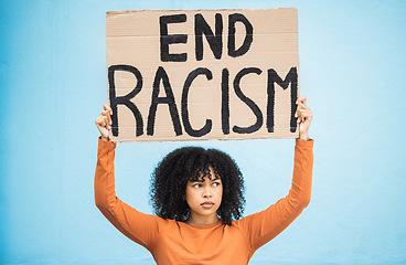 Image showing Black woman protest, sign and angry at racism, fight for equality, human rights and freedom isolated on blue background. Global problem, social justice and revolution, anger in studio and politics