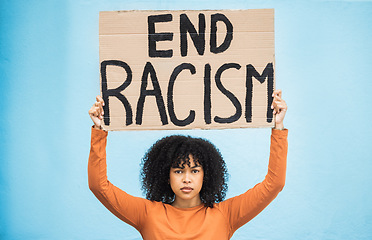 Image showing Black woman protest, poster and anger at racism, fight for equality, human rights and freedom isolated on blue background. Global problem, social justice and revolution, angry in studio and politics