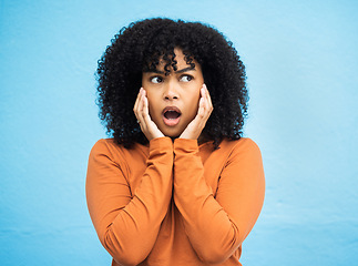 Image showing Wow, surprise and idea with a black woman in shock standing on a blue background in studio. Omg, confused and thinking with an attractive young female looking shocked or surprised indoor