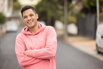 Image showing Portrait, happy and man in a street for travel, explore and proud against a blurred background. Face, smile and handsome male posing in a city, excited and cheerful about vacation trip in Mexico