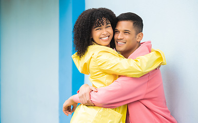 Image showing Couple, smile and hug in portrait, happy mockup with love and commitment, partner isolated on blue background. Interracial relationship, commitment and together in studio with happy people and trust