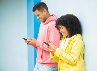 Image showing Happy people, bonding or phone typing on isolated blue background on social media, couple dating app or city networking. Smile, man or afro woman on mobile technology or community communication web
