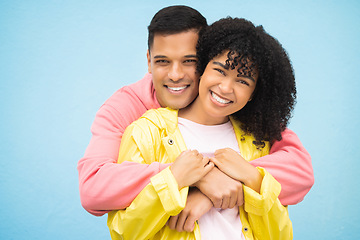 Image showing Happy people, smile and hug in portrait with couple in love, commitment isolated on blue background. Interracial relationship mockup, commitment and together in studio with black woman, man and trust