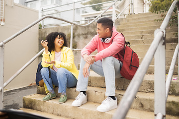 Image showing Student, friends and conversation on stairs talking about social life, class or education at the campus. Young academic university or college students chilling on staircase in funny discussion