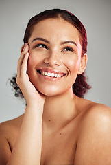 Image showing Skincare, wellness and woman with makeup in studio with cosmetic, beauty or natural face routine. Happy, smile and female model with healthy or self care facial treatment isolated by gray background.