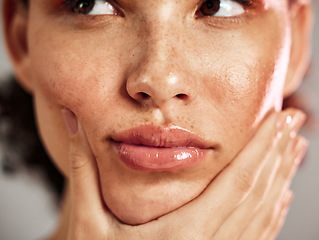 Image showing Face, freckles and woman with real skin care, thinking and makeup, cosmetics for grooming or hygiene. Beauty, collagen and girl model relax for natural, wellness and self care, pamper or routine