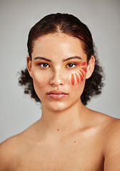 Image showing Flower petal, beauty and makeup portrait of a woman in studio for natural face and skincare. Facial cosmetic, wellness and self care for skin glow, floral sustainability and dermatology of person