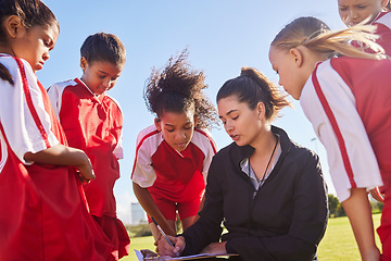 Image showing Strategy, sports or coach with children for soccer planning, training or fitness goal in Canada. Team building, teamwork and woman coaching group of girls on football field for game, match or workout