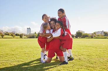 Image showing Success, soccer or winner children team hug in stadium for sports exercise, sport game or workout training. Teamwork, Canada or kids in celebrating fitness, wellness or health goal on football field