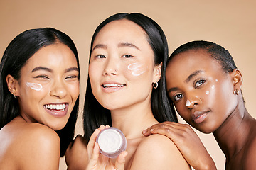 Image showing Beauty, portrait and face cream by diverse women in studio for wellness or grooming on brown background. Friends, skincare and skin lotion for girl group with different, facial and product isolated