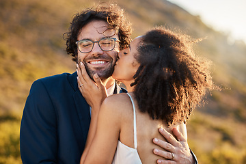 Image showing Love, kiss and wedding with couple in nature for celebration, happiness and romance. Sunset, hug and affectionate with man and woman in embrace at countryside for happy, marriage and smile together