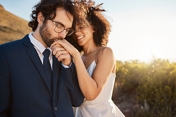 Image showing Love, happy and wedding with couple in nature for celebration, happiness and romance. Sunset, hug and affectionate with husband and wife in embrace at countryside for kiss, marriage or smile together