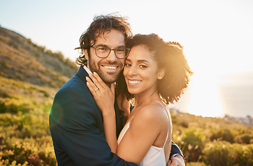 Image showing Portrait, wedding couple and interracial marriage hug in nature, happy and excited while celebrating love, beginning and romance. Face, bride and groom by black woman and man embrace, sweet and smile