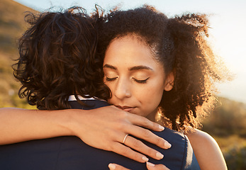 Image showing Wedding, black woman and man hug at sunset together for care, love and support for married life. Romantic, commitment and marriage event of young people in Cape Town, South Africa nature.