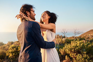 Image showing Love, wedding and bride with groom smile on mountain for marriage ceremony, commitment and celebration. Trust, happy and interracial couple relax on romantic holiday, honeymoon and vacation by ocean