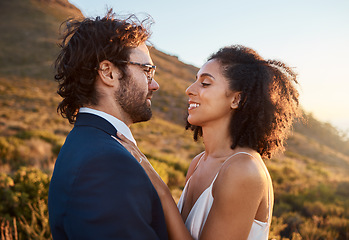 Image showing Wedding, trust and bride with groom on mountain for marriage ceremony, commitment and celebration. Love, intimate embrace and happy interracial couple hug on romantic vacation, honeymoon and holiday