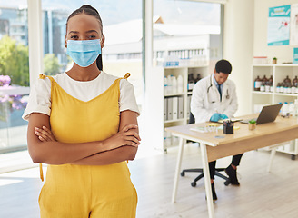 Image showing Portrait, covid and healthcare with a black woman patient in a hospital standing arms crossed for her vaccination. Vaccine, mask and medical with a female in a clinic for heakth, cure or treatment