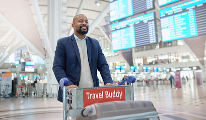 Image showing Travel, airport or black man walking with suitcase, luggage or bags in trolley at customs with a happy smile. Airplane, pride or African businessman traveling via international flight transportation