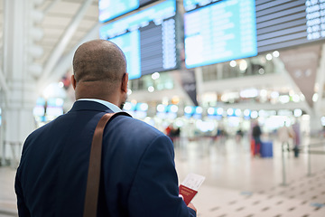 Image showing Travel, airport or black man walking with passport, suitcase or tickets to customs in New York city. Back view, airplane or African businessman traveling via international flight transportation alone