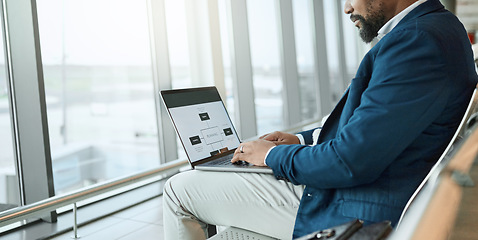 Image showing Travel, businessman and at an airport working on a laptop and waiting at terminal or boarding lounge. Entrepreneur, corporate or employee using computer at airline hub about to go on a flight