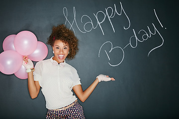 Image showing Excited, happy birthday balloons and portrait of a model and chalkboard for celebration. Happy, smile and excited person with birthday words and party sign to celebrate fun event with style in studio