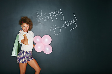 Image showing African woman, balloons and happy birthday present for party fun, happiness and wow celebration. Young black woman, smile portrait and festive sign, event announcement and excited with gift in studio