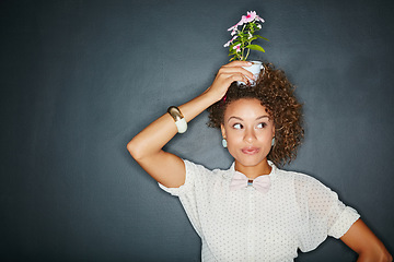 Image showing Flower plant, beauty studio and black woman thinking with natural green flowers, agriculture plant or nature product. Marketing, mockup or eco friendly fashion model isolated on chalkboard background