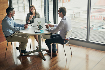 Image showing Meeting, conversation and business people planning strategy, finance idea and partnership on a laptop. Teamwork, plan and corporate employees talking about financial agency innovation with notes