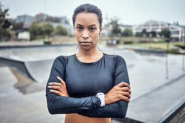 Image showing Fitness, sports and portrait of a woman in the city for an outdoor run, exercise or training. Serious, motivation and young female athlete or runner with crossed arms after a cardio workout outside.