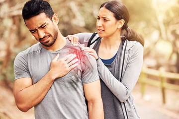 Image showing Fitness, pain and injury with a woman massaging the shoulder of her boyfriend while running outdoor. Exercise, medical and hurt joint with a couple training outside during a workout for health