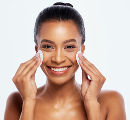 Image showing Beauty, skin and cotton for black woman portrait studio for dermatology, cosmetics and natural skincare. Aesthetic model person cleaning face or makeup for healthy glow isolated on a white background