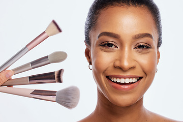 Image showing Beauty, makeup brush and face for woman portrait in studio for dermatology, cosmetic and natural glow. Happy aesthetic model person with facial tools for a healthy skin isolated on a white background