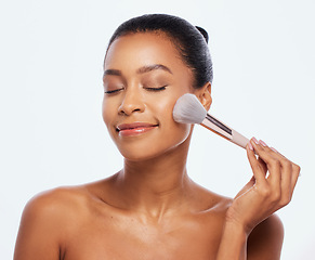 Image showing Beauty, makeup and brush for face of woman in studio for makeup, cosmetics and natural skin. Aesthetic model person with facial tools for a healthy glow or shine isolated on a white background