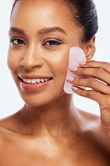 Image showing Skin care, gua sha and face massage for woman portrait in studio for dermatology and natural glow. Happy aesthetic model person with spa stone for healthy facial shine isolated on a white background