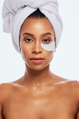 Image showing Skin care, eye patch and beauty portrait of a woman in studio for dermatology and cosmetics. Aesthetic model person for spa facial, towel and healthy or natural face glow isolated on white background