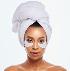 Image showing Beauty patch, eye skincare and woman portrait in studio for natural dermatology. Aesthetic model for spa facial, towel and healthy or clean face glow cosmetic product isolated on a white background