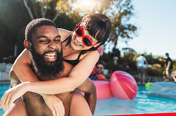 Image showing Pool party, love and couple piggyback, having fun or bonding. Swimming, romance diversity and happy black man carrying woman in water and laughing at comic joke or meme at summer event or celebration