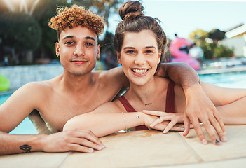 Image showing Party, swimming and portrait with a couple of friends in the pool outdoor together during summer. Love, water and diversity with a young man and woman swimmer enjoying a birthday or celebration event