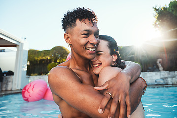 Image showing Love, pool party and couple hug, having fun and bonding together. Swimming, romance diversity and happy man and woman hugging, cuddle or laugh at funny joke in water at summer event or celebration.