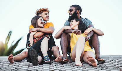 Image showing Relax, happy and couple of friends on a roof for communication, happiness and summer in Miami. Conversation, diversity and group of talking men and women on a house for speaking, enjoyment and party