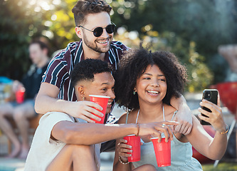 Image showing Friends, selfie and party outdoor, drinks and playful in summer, bonding together and celebration. Young people, men and black woman with smartphone, share picture or event outside, alcohol and smile