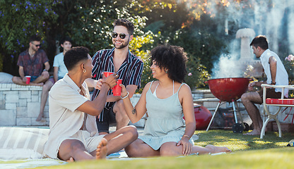 Image showing Party, diversity and toast with friends outdoor together at a bbq in summer for a social event or celebration. Alcohol, cheers or birthday with a young man and woman friend group celebrating outside