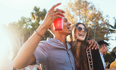 Image showing Party, drinks and a couple of friends outdoor to celebrate at festival, concert or summer social event. Diversity young men and women people together while dancing, happy and drinking alcohol