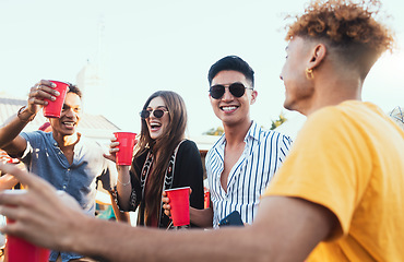 Image showing Group of friends, drinks and a party outdoor to celebrate at festival, celebration or summer social event. Diversity young men and women people together while talking, happy and drinking alcohol