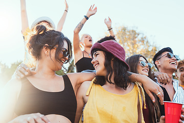 Image showing Couple of friends, party and drinks outdoor to celebrate at festival, concert or summer social event. Women people in crowd together while dancing, happy and drinking alcohol with lgbt partner