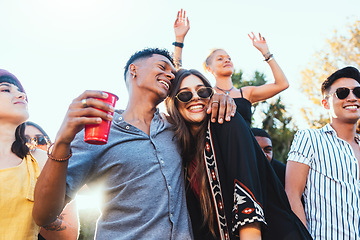 Image showing Outdoor party, drinks and a couple of friends celebrate at festival, concert or summer social event. Diversity young men and women people together while dancing, happy and drinking alcohol in crowd