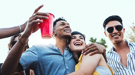 Image showing Couple of friends, party and drinks outdoor to celebrate at festival, concert or social event. Diversity young men and women people together while dancing, happy and drinking alcohol in crowd