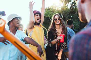 Image showing Music, drinks and friends dancing outdoor to celebrate at festival, concert or summer social event. Diversity young men and women people together while excited, happy and drinking alcohol at a party