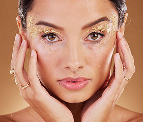 Image showing Makeup, glitter and face portrait of woman with luxury gold eyeshadow, cosmetics product and facial skincare glow. Beauty, spa salon or aesthetic model girl with sparkle, shine or healthcare wellness