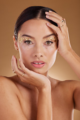 Image showing Cosmetics portrait, face glitter and woman with luxury gold eyeshadow, beauty product and studio skincare glow. Makeup, spa salon or aesthetic model girl with jewelry ring, accessories and wellness